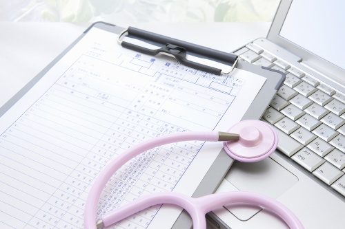 image of chart and stethoscope on laptop (c) ShutterStock
